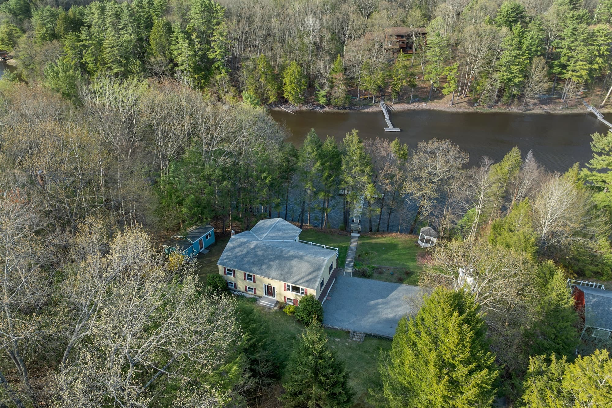 Aerial from the river side, showing the house, outbuilding, gazebo, and dock