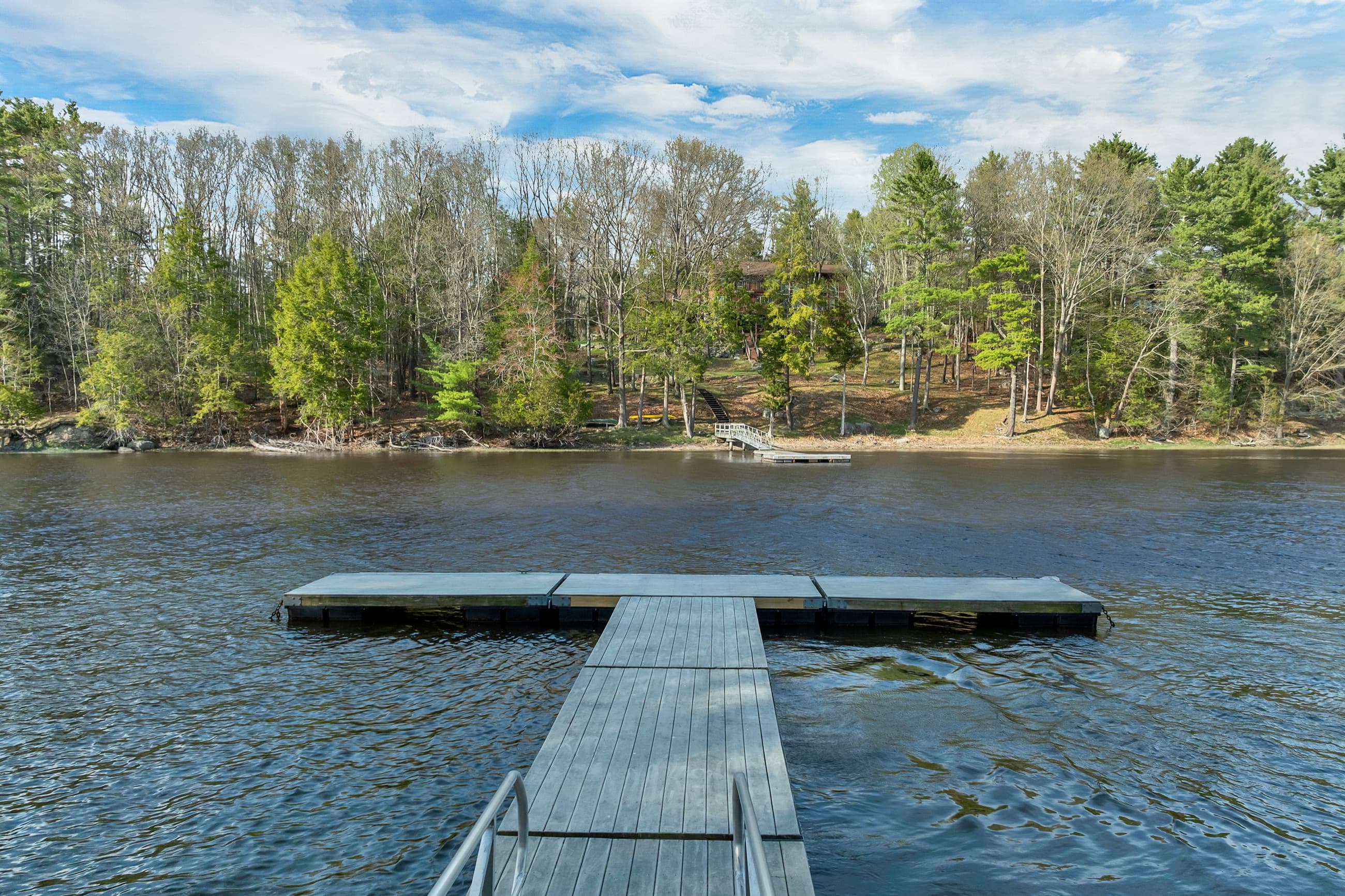 Looking out from the dock across the Lamprey River to the far bank